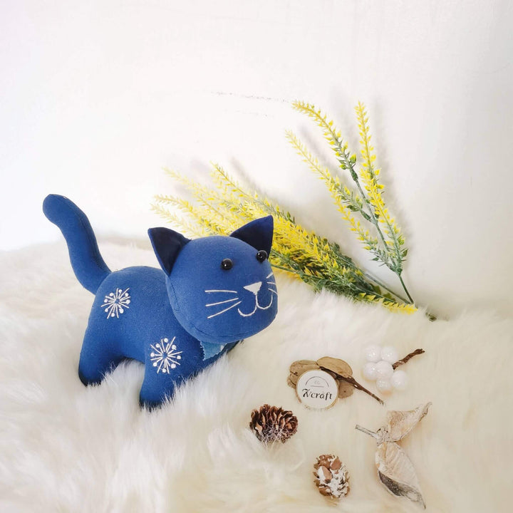 Plant dyed indigo cat toy on a wool blanket, handmade natural cotton fabric stuffed animal doll